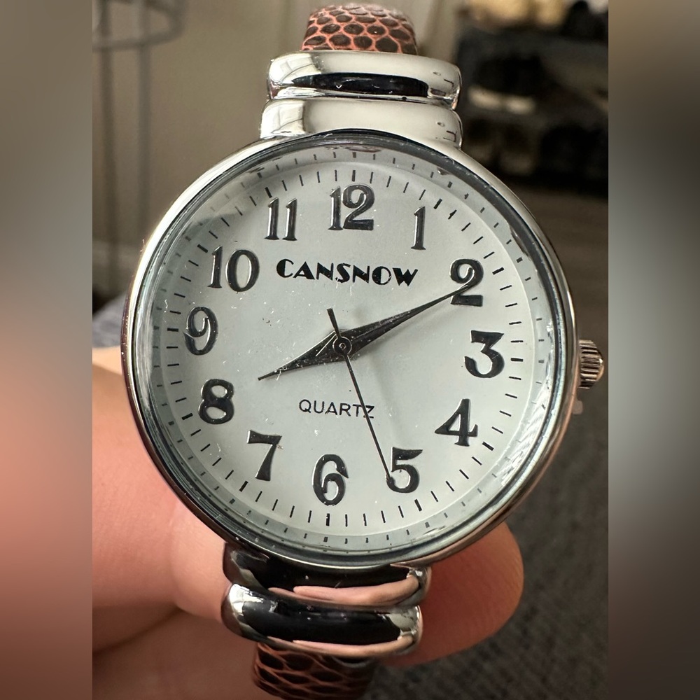 Women’s Cansnow quartz watch (Brand new) with spring loaded band.
